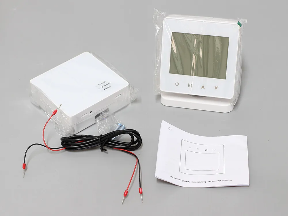 Gas boiler wireless thermostat with packaging, wiring, and instruction manual.